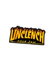 Sticker with 'Unclench Your Jaw' text on a metallic surface