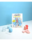Bath bomb and soap maker products taken out of package to show what is included, and examples of what kids will make with this kit.