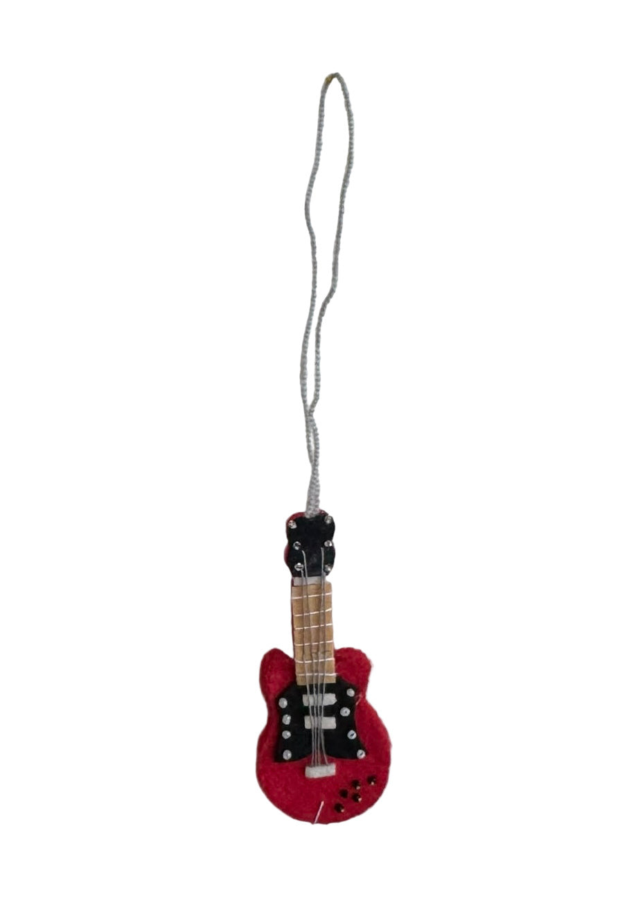 Red guitar-shaped ornament on a white background