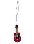 Red guitar-shaped ornament on a white background