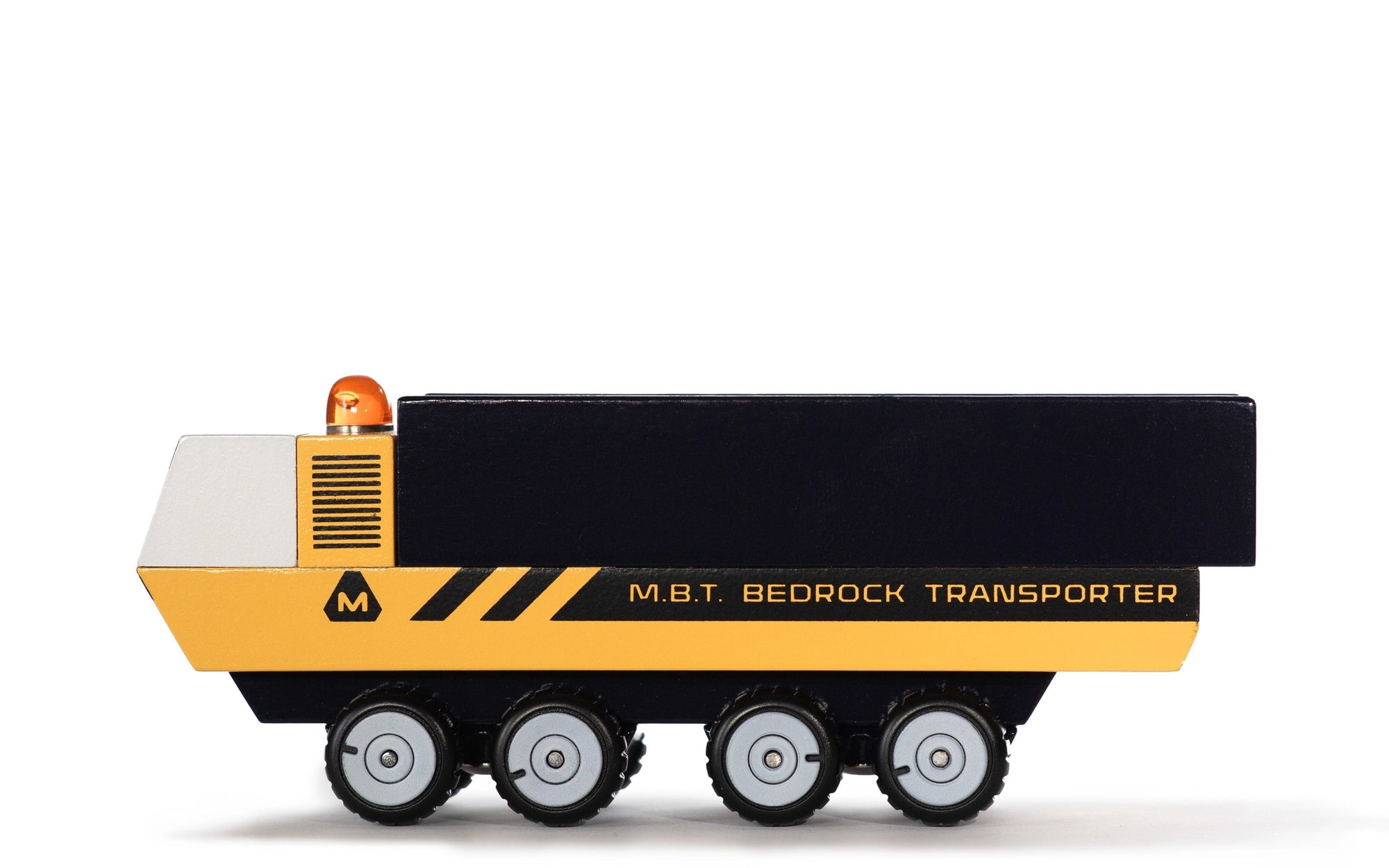 Toy model of a M.B.T. Bedrock Transporter on a white background