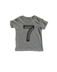Gray tee screen printed with black number 7.