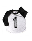 Baseball tee white with black sleeves screen printed with black number 1.