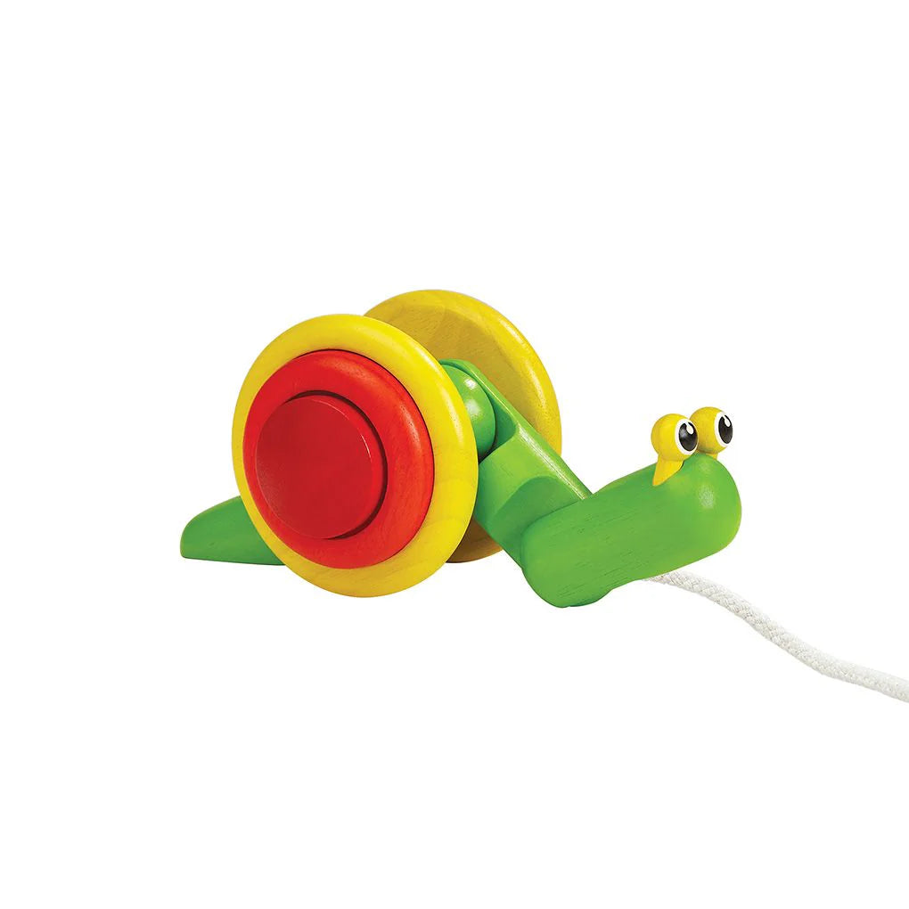 Colorful wooden pull-along snail toy on a white background