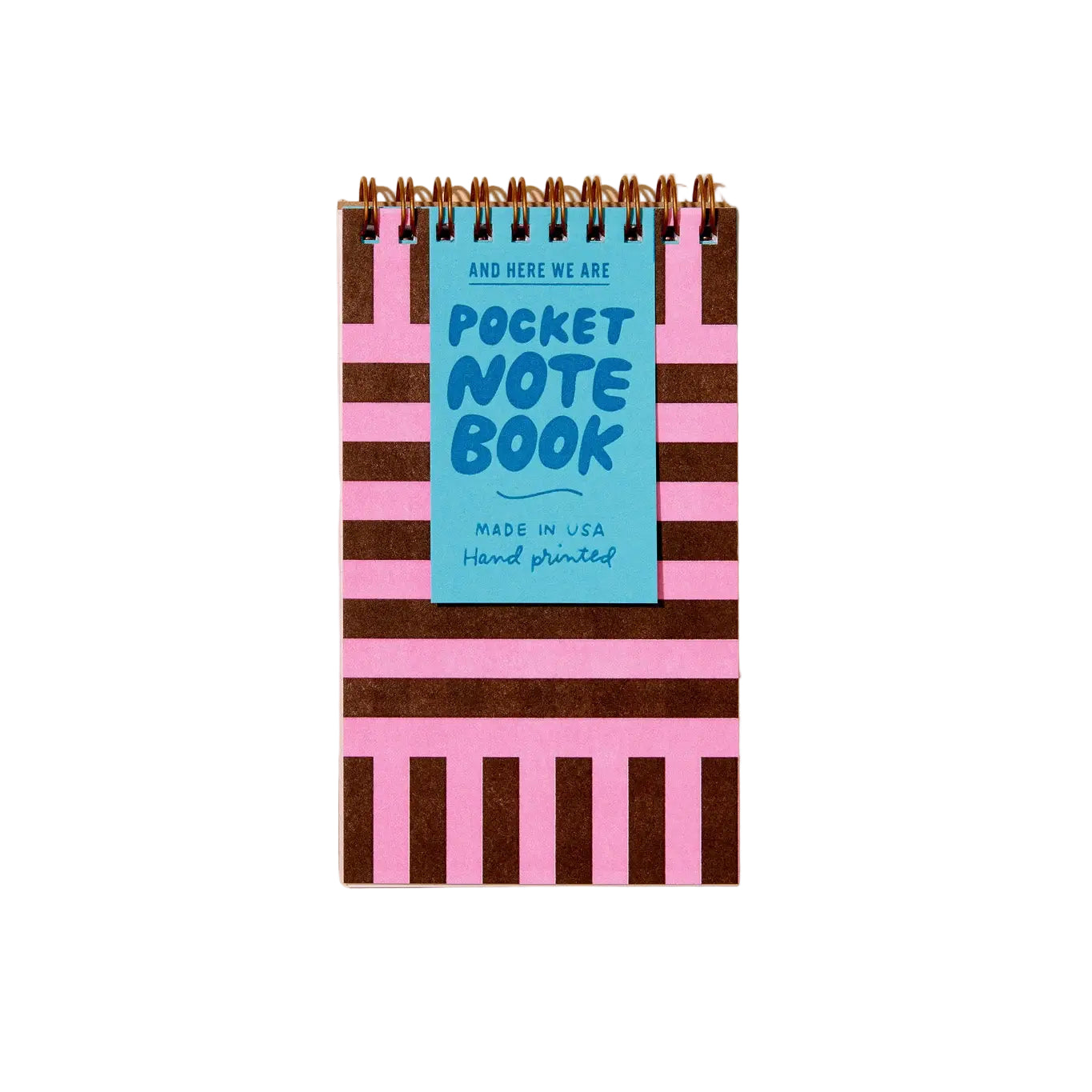 Pocket notebook with striped cover and blue label on a beige background