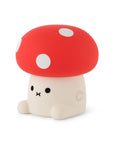 Mushroom shaped night light with cute face and red cap and white spots.