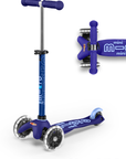 A blue and light blue three wheeled push scooter with the front two wheels lit up with LED lights.