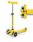 A Yellow and Light Yellow three wheeled push scooter with the front two wheels lit up with LED lights.