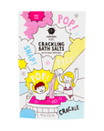 A pouch of Pink Nailmatic Kids Crackling Bath Salts with colorful playful graphics depicting children bathing and bubbles.
